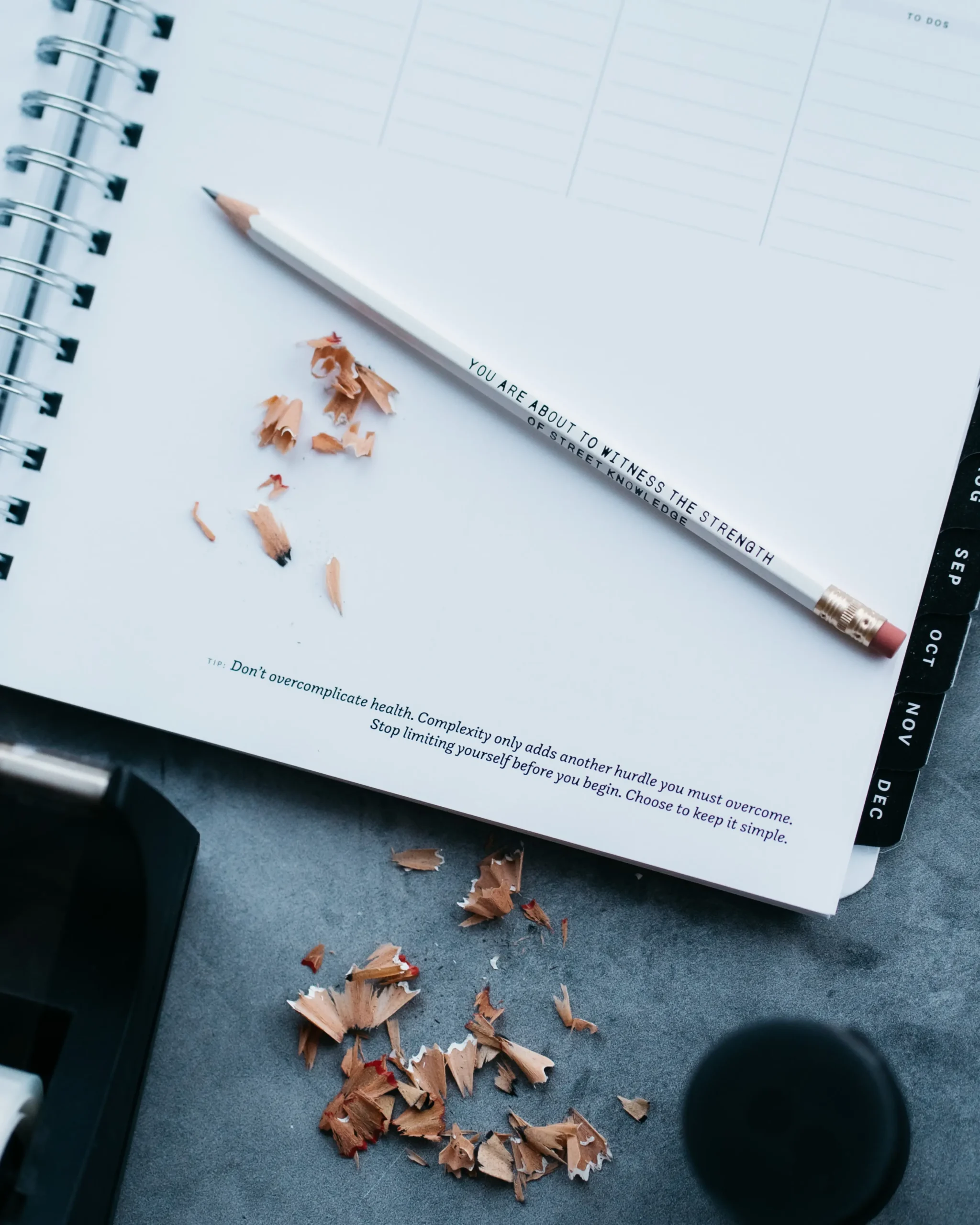 Close-up of Nourished Planner page showing outcome creation, habit tracking, and aligned daily actions.
